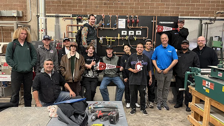 Attendees of Red Rocks Community College posing with the donation from NIBCO and Webstone.