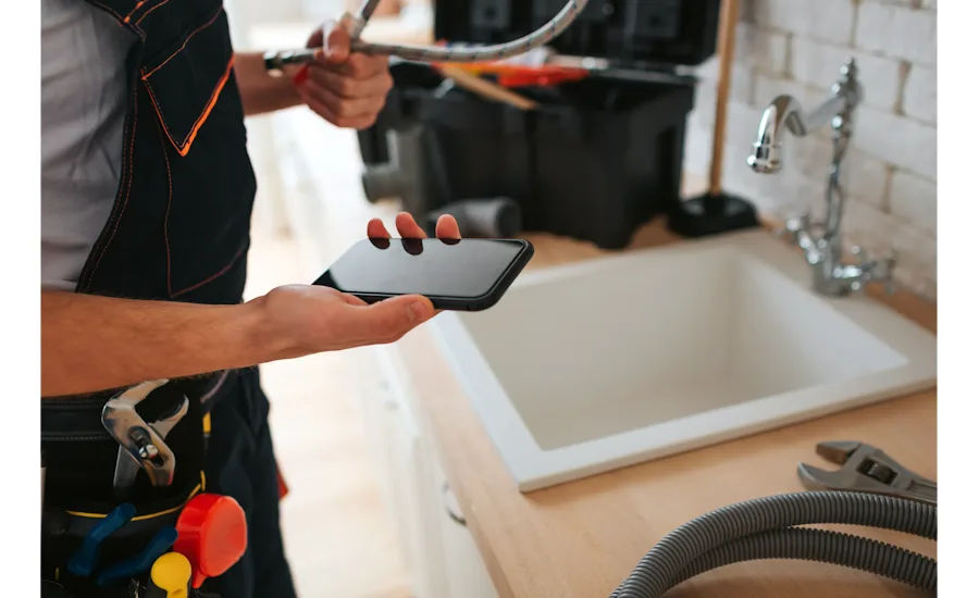 Plumber with cell phone
