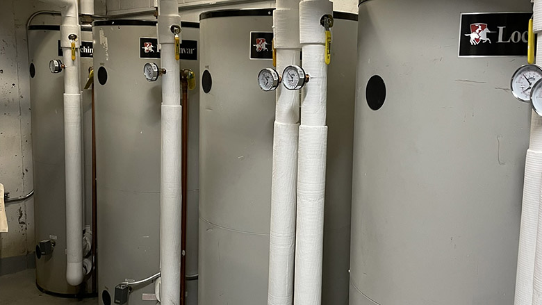 Several Lochinvar Veritus heat pump water heaters.