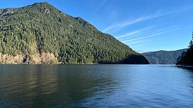 A lake with a mountain in the background.
