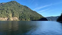 U.S. Businesses Turn to Water Efficiency to Beat Rising Costs A lake with a mountain in the background.