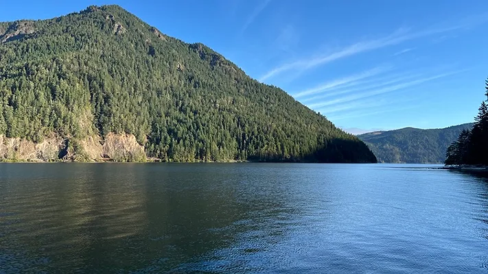 U.S. Businesses Turn to Water Efficiency to Beat Rising Costs A lake with a mountain in the background.