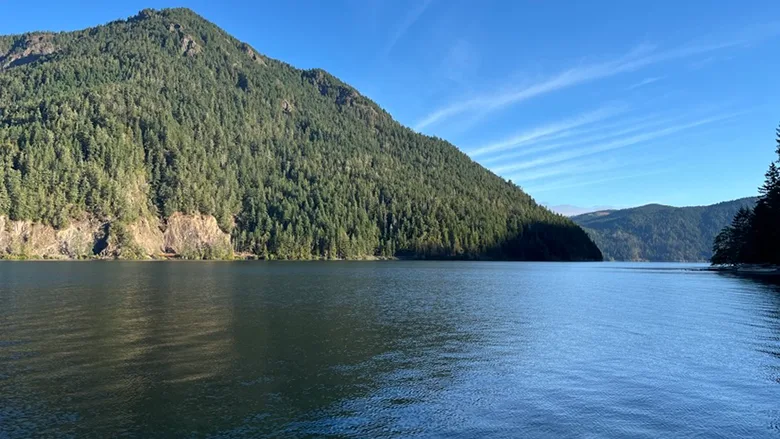 A lake with a mountain in the background.