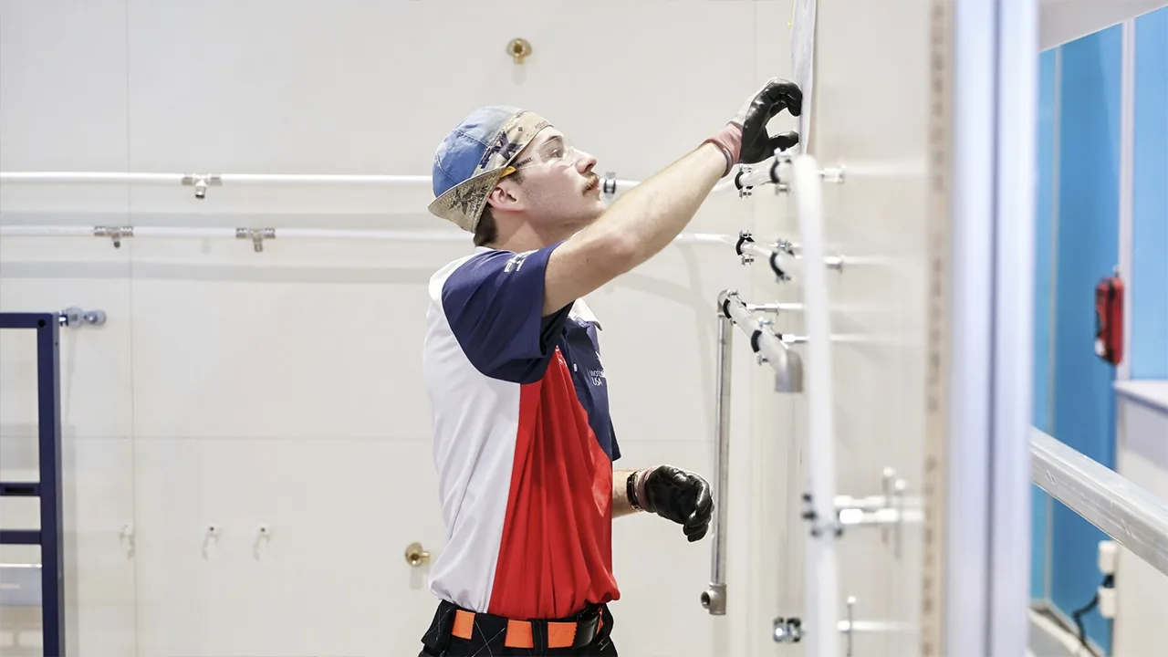 Charles "Charlie" Goede competing at the WorldSkills Plumbing & Heating competition.