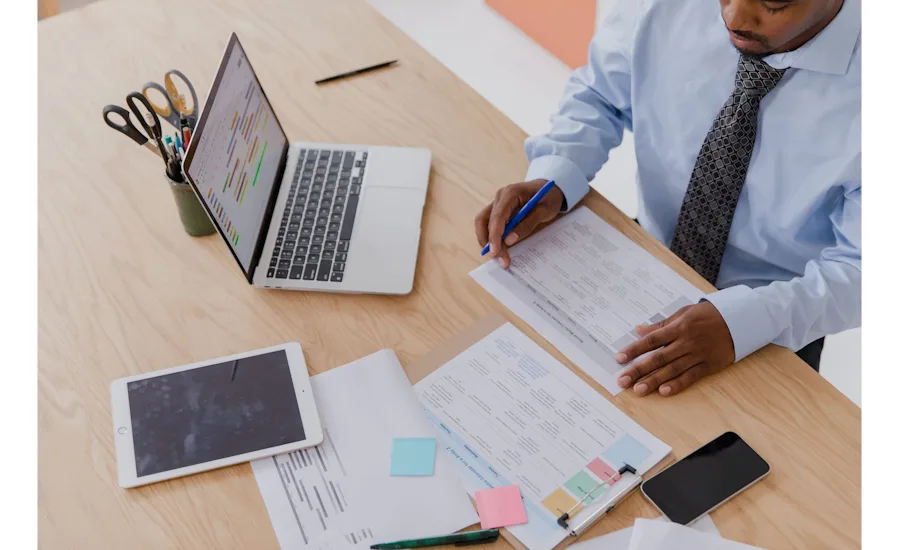 Owner reviewing numbers at desk