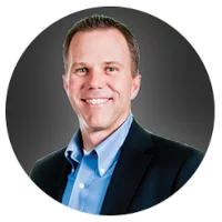 Kenny Chapman headshot with a white round border frame, 200x200