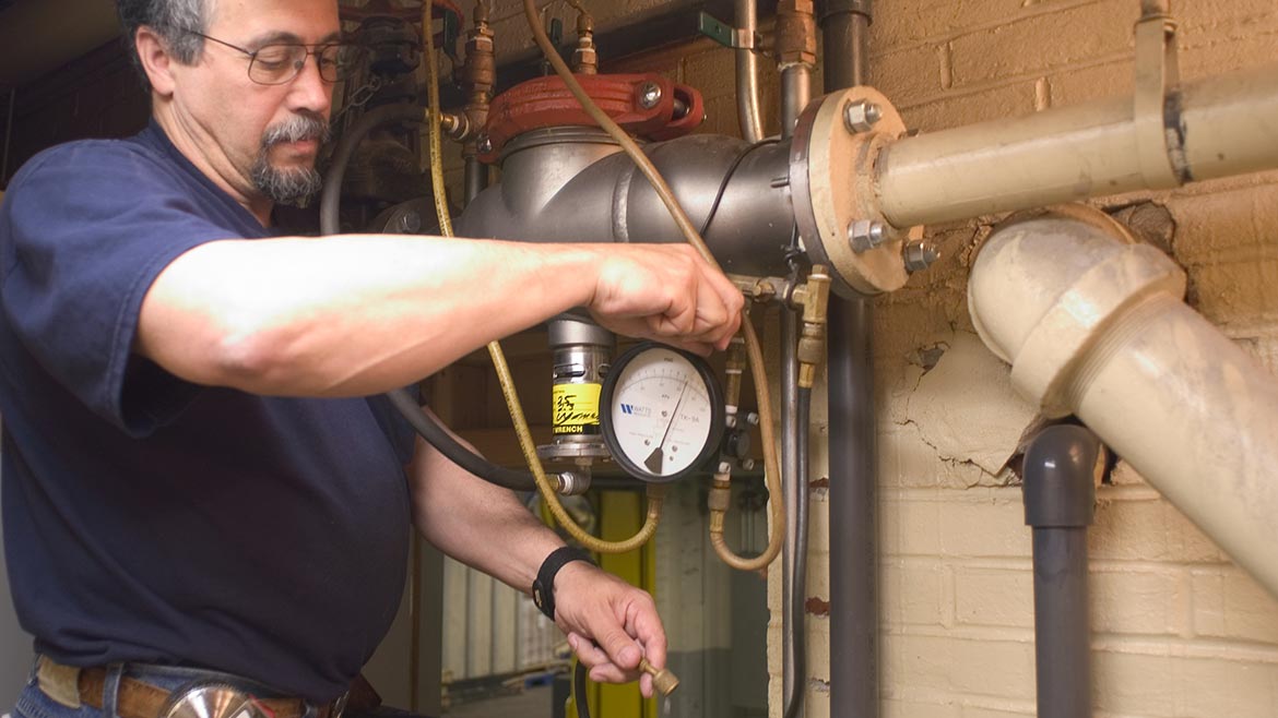 Dave Yates performs a backflow test 