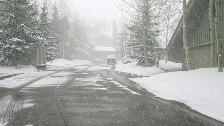 accumulation on a driveway during snowfall