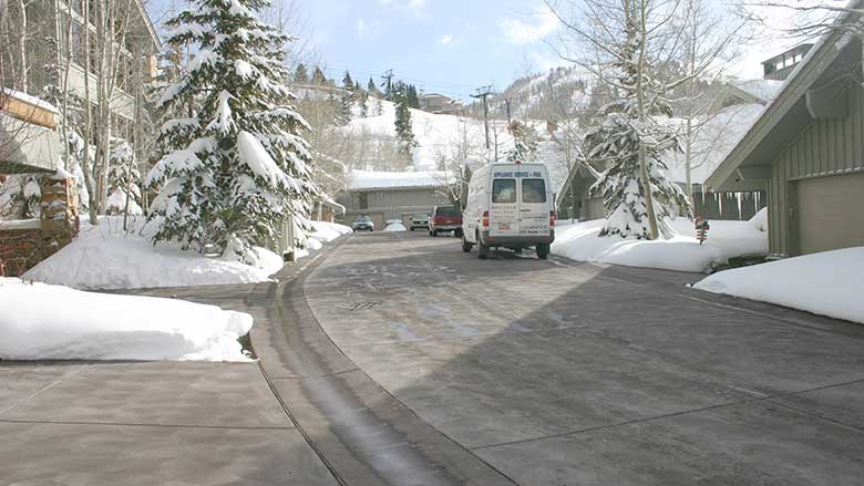 accumulation on a driveway during snowfall
