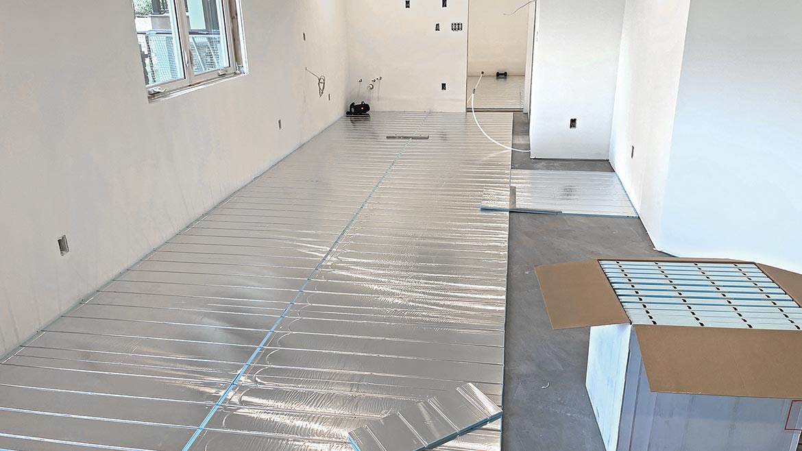04 PM 1123 Radiant Comfort Report 2023 Winter Jason Gaspard Residence Uponor Xpress Trak panels on basement flooring