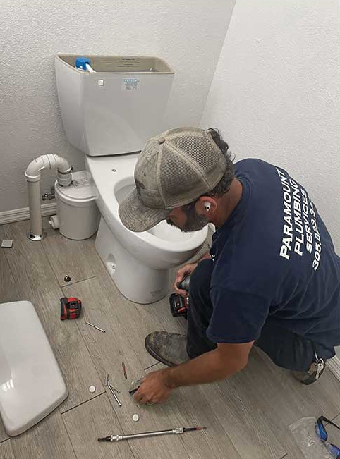 Contractor fixing toilet