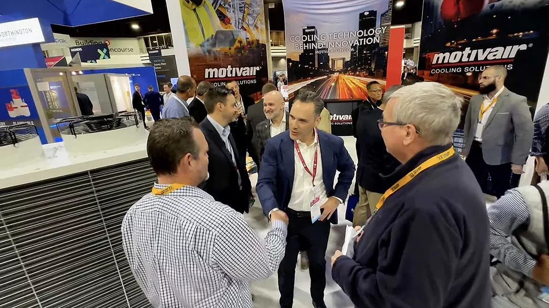 AHR Expo feature: 2023 AHR Expo in Atlanta attendees meet an exhibitor.