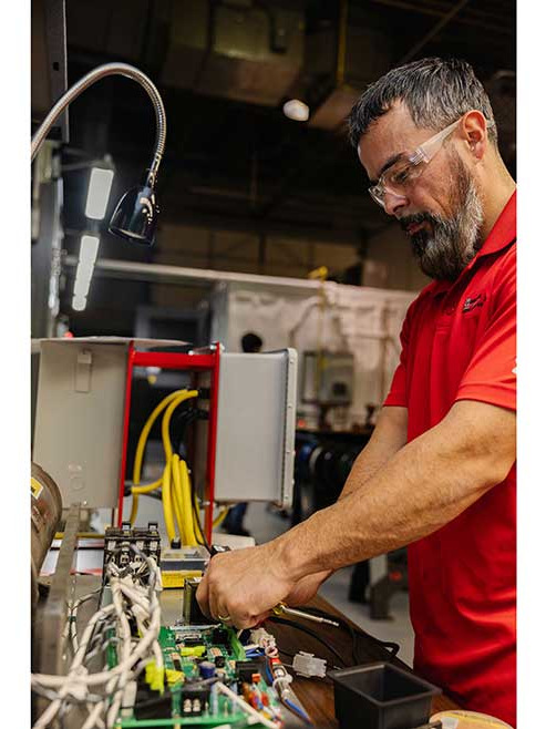 A U.S. Boiler Co. employee works in the Ambient Lab.