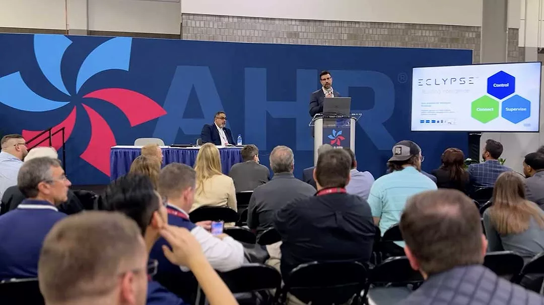 AHR Expo feature 2023 AHR Expo in Atlanta attendees sit in on exhibitor presentation.