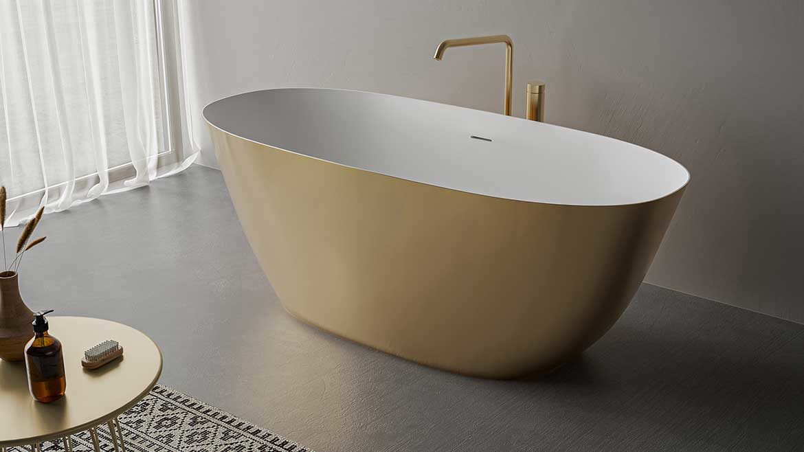 KBIS Product Preview: Ruvati Freestanding Bathtub in gold with a white interior.