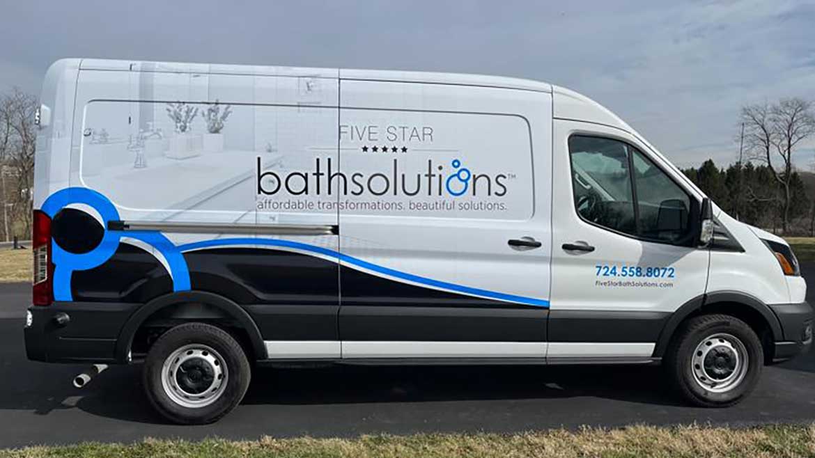 Bath Solutions sign on side of van