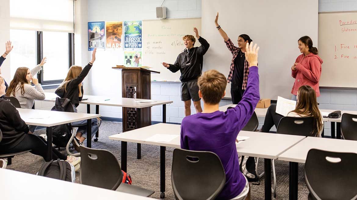 Chicago Faucet feature image of a classroom with students raising their hands.