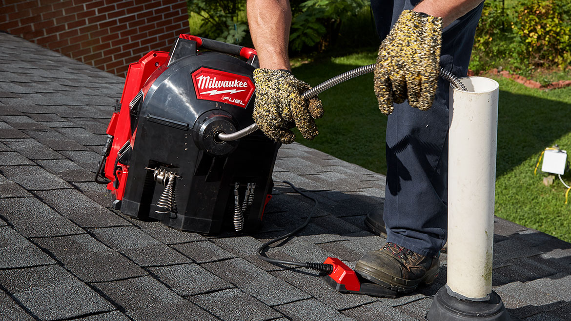 Milwaukee Tool’s M18 FUEL SWITCH PACK Sectional Drum System 3/8' Kit being used on the roof.