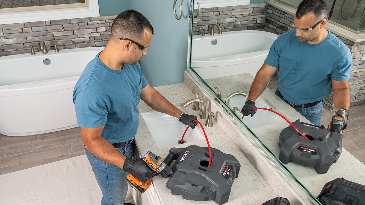 RIDGID’s K9-12 is the smallest of the machines and perfect for residential use. Here it's being used in a bathroom sink.