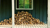 Stack of Firewood Stack of Firewood against a cabin wall