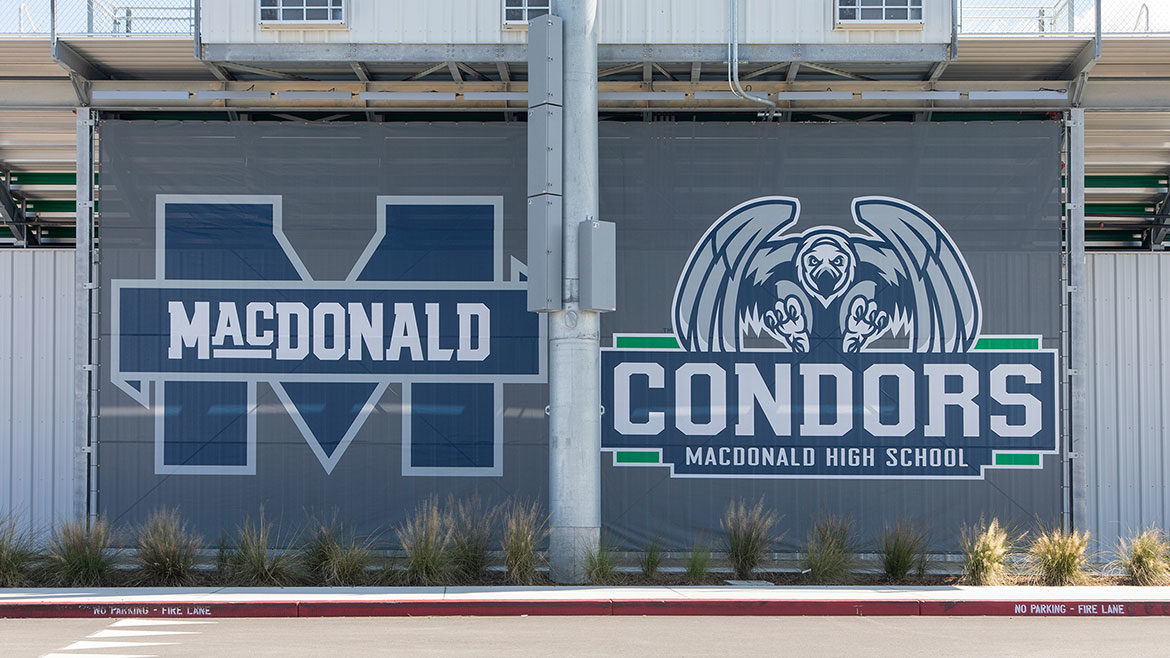 Kathleen MacDonald High School name and logo, Condors logo on wall.
