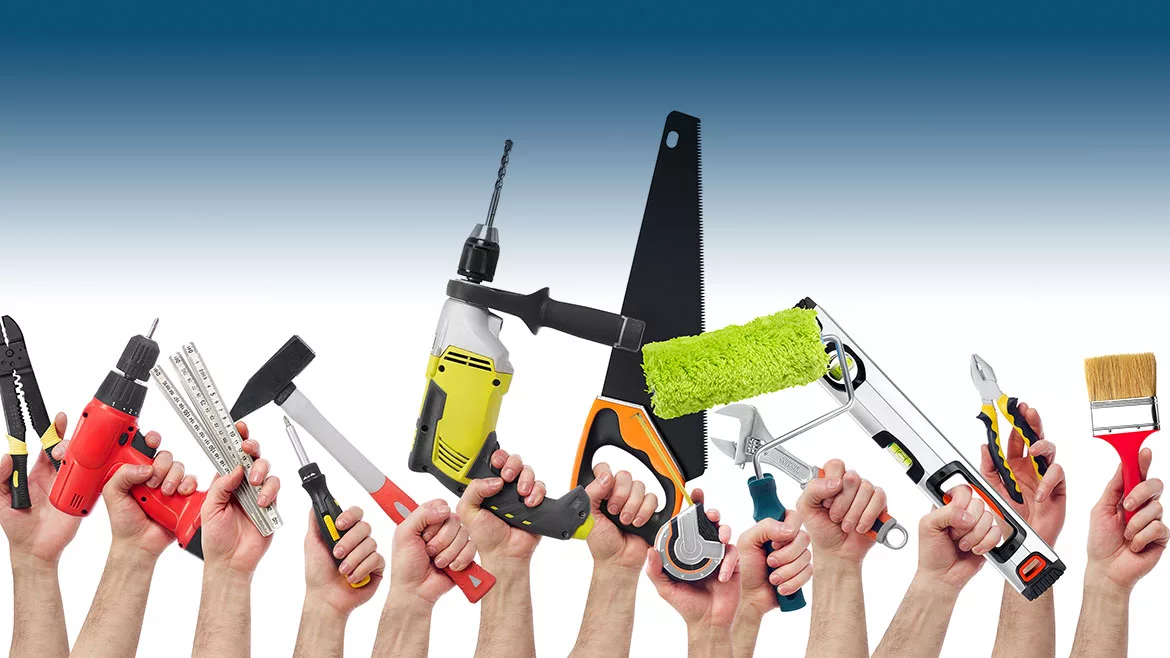 Hands across the bottom holding up various tools