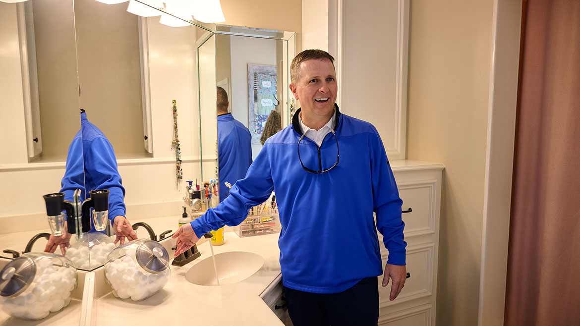 Grundfos' ALPHA high-efficiency variable speed circulator demonstarted in bathroom sink.