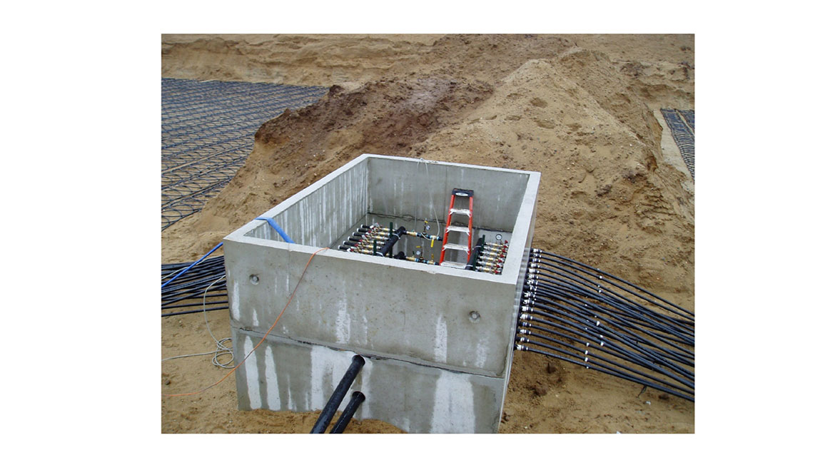 Figure 7 An example of a pre-cast concrete vault that houses two sets of supply and return manifolds for a large geothermal heat pump system.