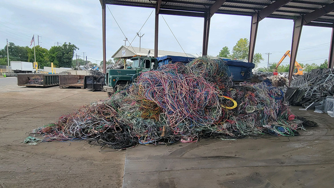A huge pile of scrap wire in varying colors at a local New Jersey junkyard.