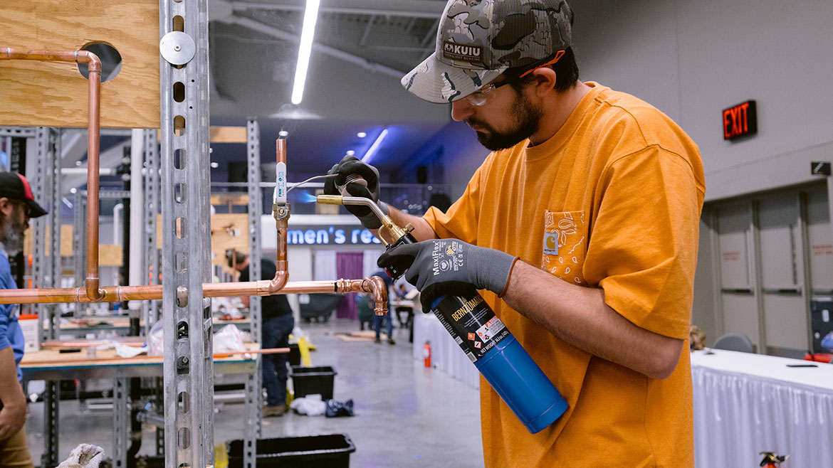 An apprentice working on soldering.