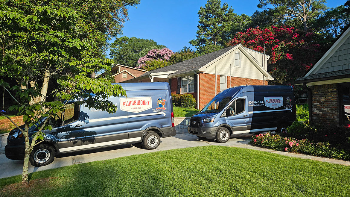 New vans on a driveway.