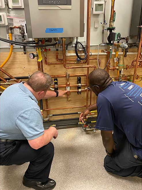 Eric Love listening to an instructor during class at PPATEC.