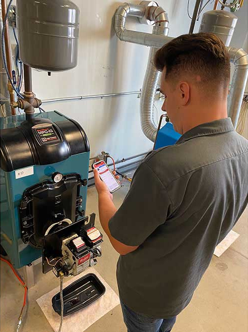 Eric Snyder, a student at PPATEC, is in the lab working.