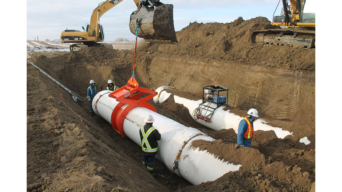 A work crew installs IPEX’s Centurion PVC distribution system.