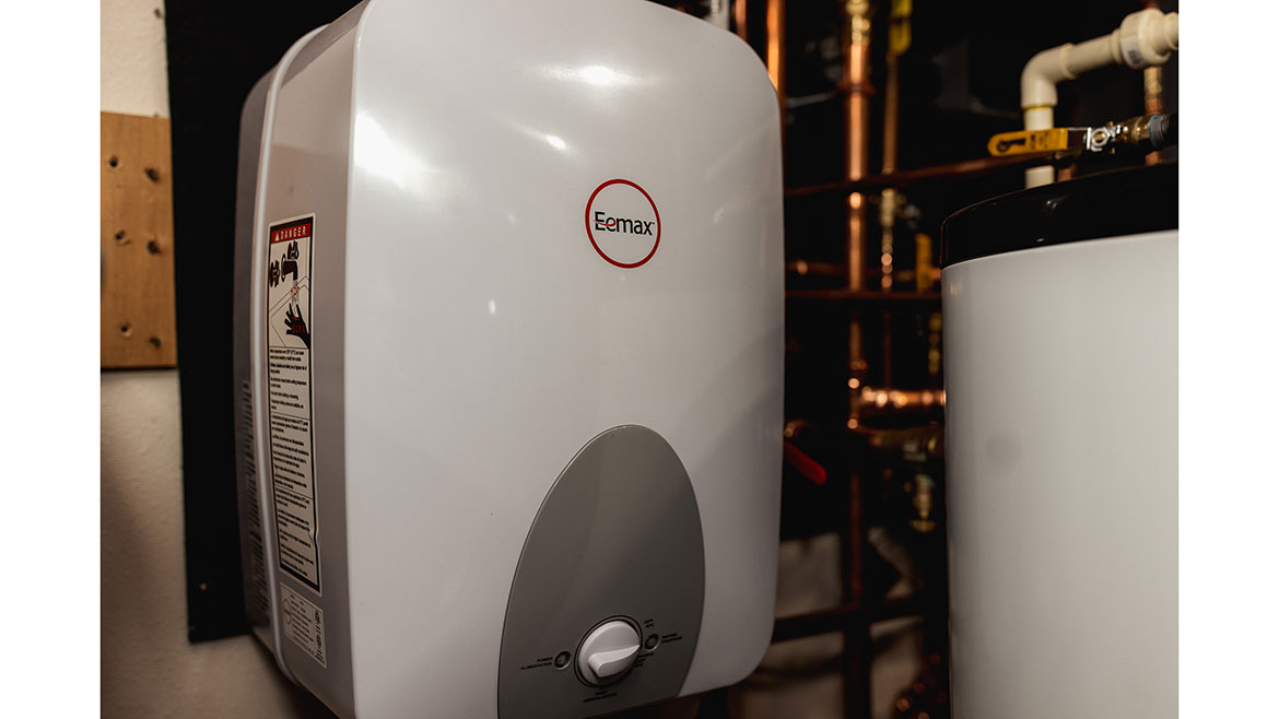 Small, point-of-use electric water heater.