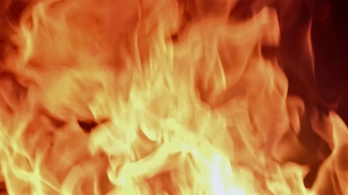 Fire flames burning and glowing on dark background.