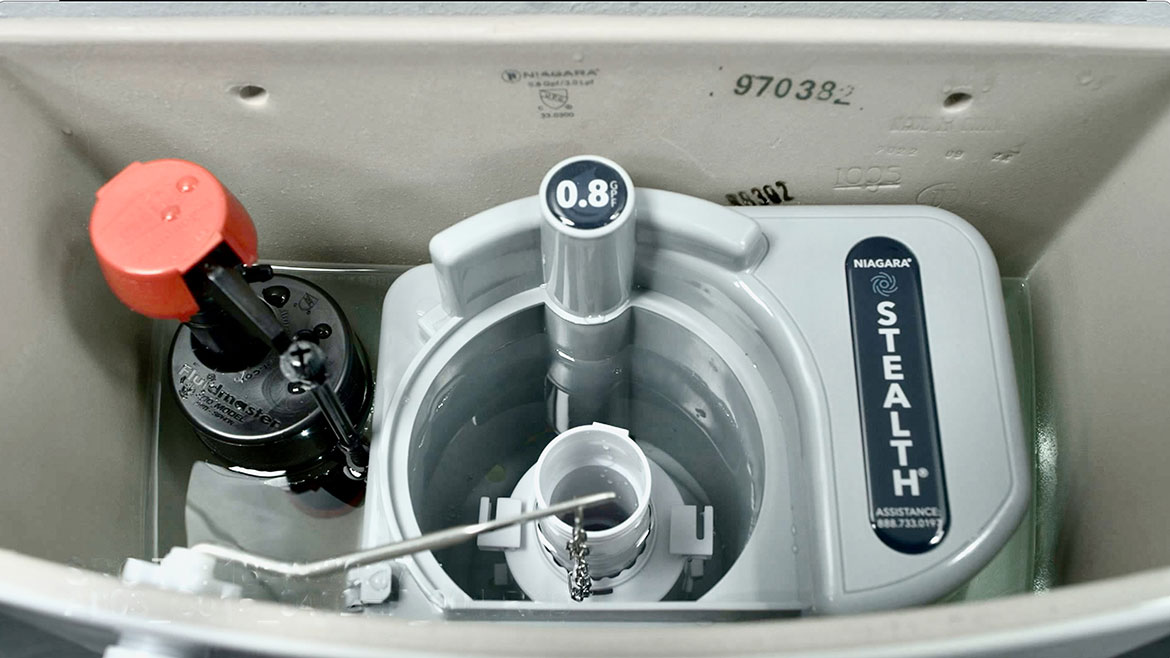An open toilet tank showing the Niagara STEALTH.