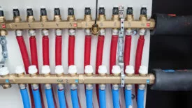 Temperature gauges on a collector in a cabinet