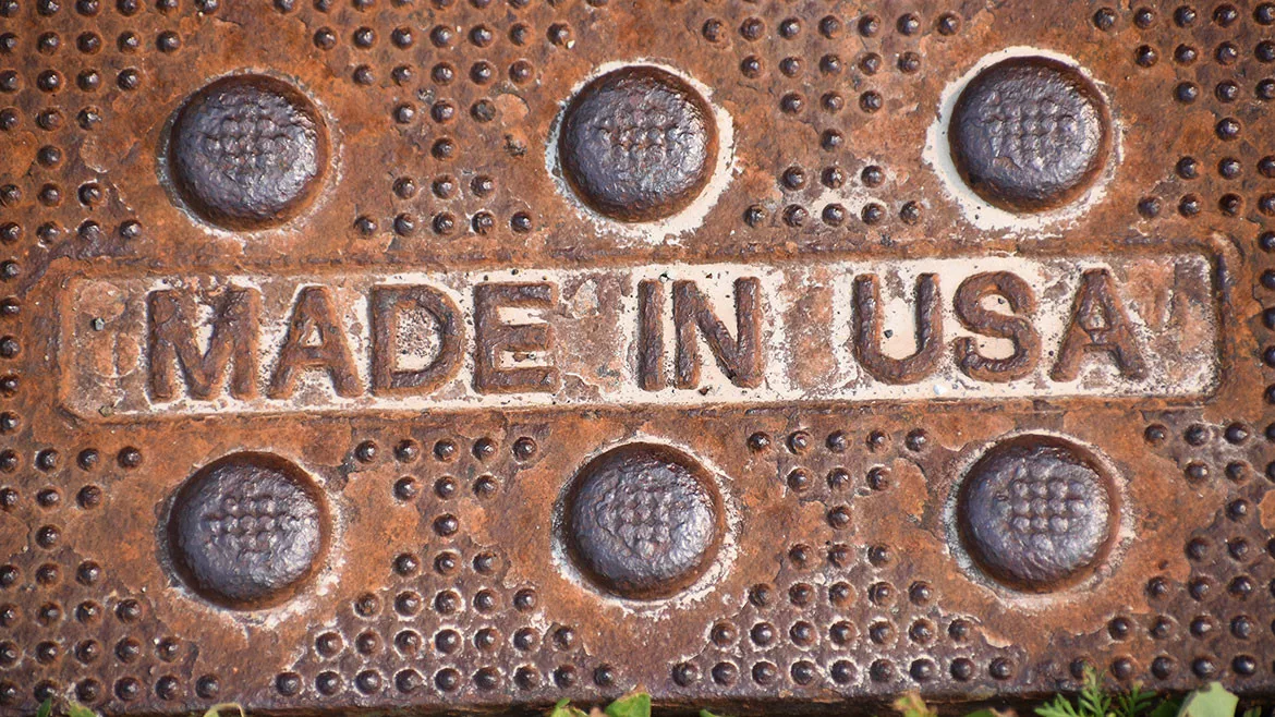 MADE IN USA text sign on rusty worn manufacturing metal
