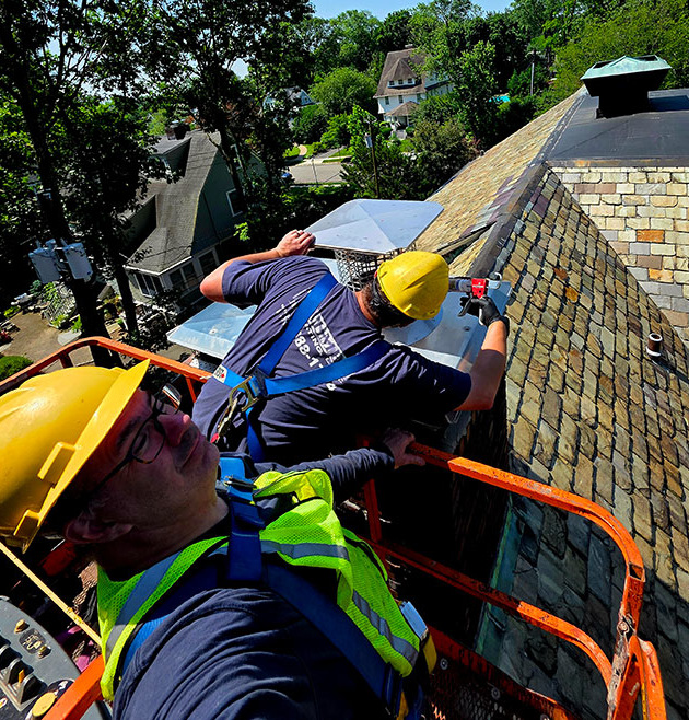 Two-man crew on the left working on the chimney.