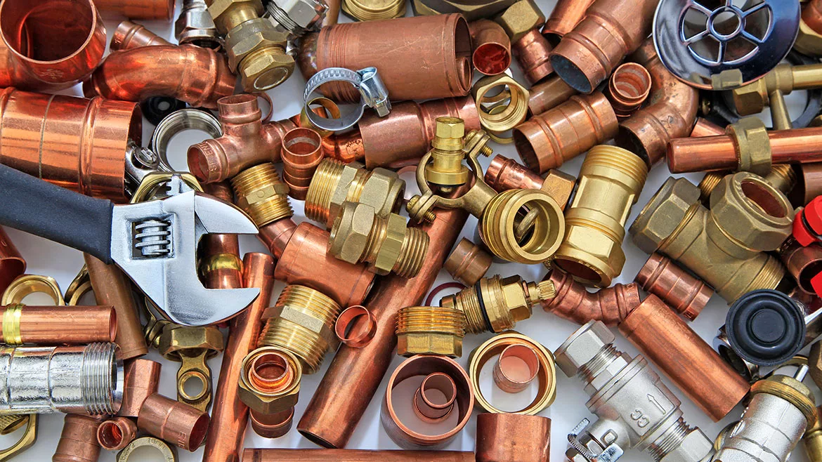 Random mixture of copper pipe and brass fittings.
