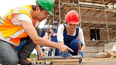 Plumbing student receiving on-site instructions.