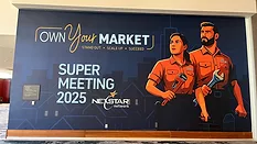 Super Meeting 2025 poster. 'Own Your Market' with illustrated man and woman in plumbing uniform, each holding a wrench.