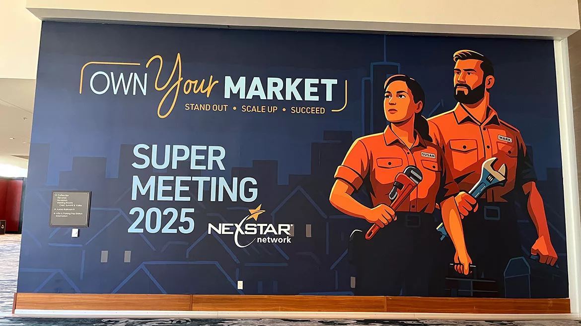 Super Meeting 2025 poster. 'Own Your Market' with illustrated man and woman in plumbing uniform, each holding a wrench.