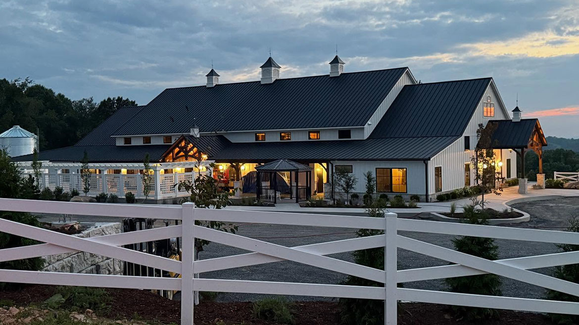Exterior shot of White Oak 1838 in the evening with the lights on.