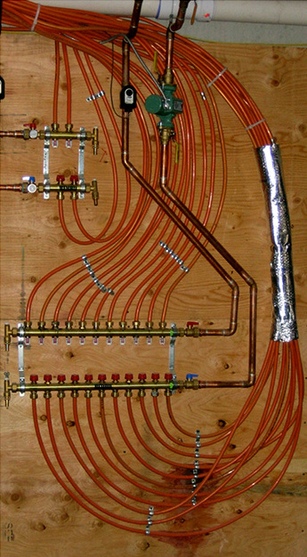 Figure 2 the 3/4” copper tubing that tees into that boiler loop going down to a manifold station.