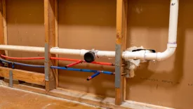 Plumbing pipes in kitchen renovation.