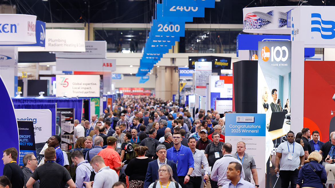 A large group of AHR Expo attendees walking through the event floor.