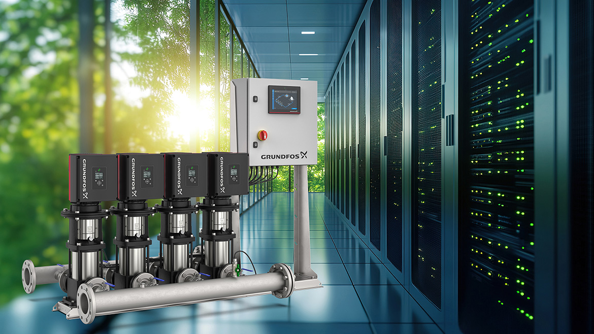 Grundfos pump system and control panel in a data center, overlooking the outside full of trees.