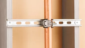 Commercial pipe support system installed on a wall.